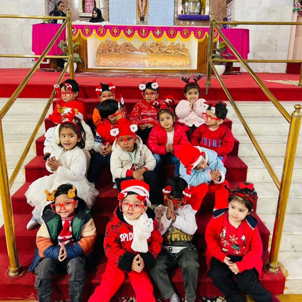 The festive spirit was in full swing as students celebrated Christmas with immense joy and enthusiasm. Dressed in red and white, the day began with a heartfelt prayer at the church, followed by cheerful moments with Santa, who delighted them with candies and joined them in singing 